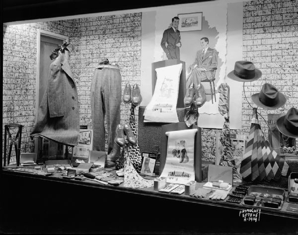 Display window at Rundell's Inc., men's clothing store, 15 East Main Street, featuring men's clothing and Weyenberg shoes.