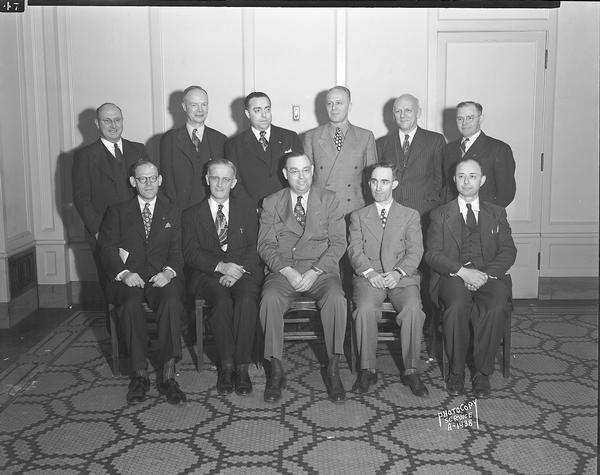 Group portrait of eleven male executive board members taken for CUNA (Credit Union National Association) <I>Bridge</I> Magazine.