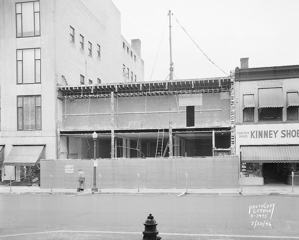 Remodeling of Montague building at 8-12 East Mifflin Street for expansion of Manchesters Department Store and the Madison Room restaurant.  Businesses previously located in the building were Walk-Over Shoe Store, Moseley's, and Nancee Hat Shop. Also shows Kinney Shoe Store, 14 East Mifflin Street.