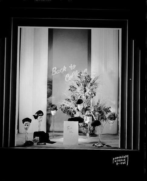 H.S. Manchesters Inc. window display featuring fur hats for back to college. Display contains sign saying: "Furs go to your head."