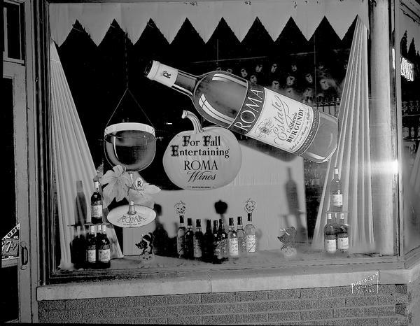 Roma Wine window display, Corcorans Liquor Store, 2605 University Avenue, with sign which reads: "For Fall Entertaining, ROMA Wines."