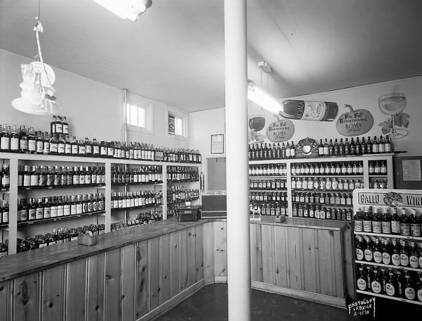 Sam's Liquor Store, 422 North Street, interior view of shelf displays of various wines, including Roma and Gallo, and other liquor bottles.