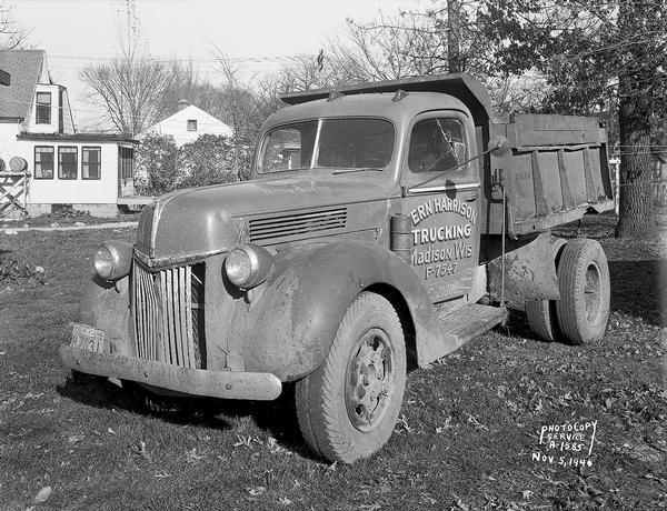 Verona Road, Blizzard Boy accident scene; three-forth view of Vern Harrison Trucking truck, showing blood stain on mud flap on the left side of the truck. Site is near the Illinois Central Railroad Summit viaduct about 1 mile west of Madison. Scene of traffic accident in which Jerry Blizzard, 9 years old, was killed. Jerry was struck by a car and a dump truck while riding a bicycle on Verona Road in front of his home.