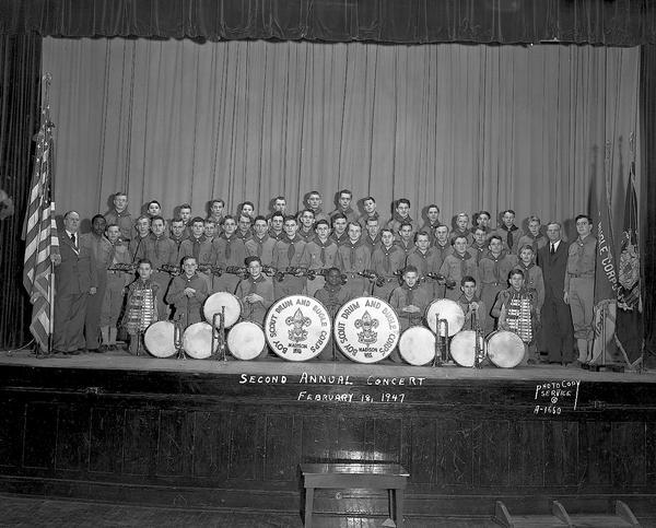 Group portrait of Boy Scout Drum and Bugle Corps at second annual concert on the Central High School auditorium stage.