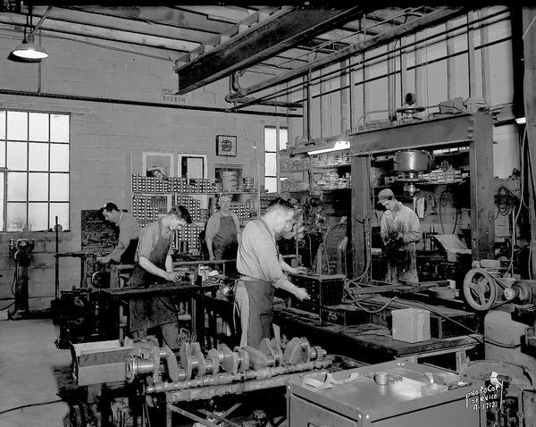 Winnebago Auto Replacement Company, 103 North Park Street. Interior view showing machine shop with five machinists at work.