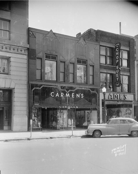 Art Deco storefront, Carmen's women's clothing store, 9 South Pinckney Street. Also shows Ames Dress Shop, 11 South Pinckney, and Madison Inn (Nom Yee's Chop Suey) Cafe, 11 South Pinckney.
