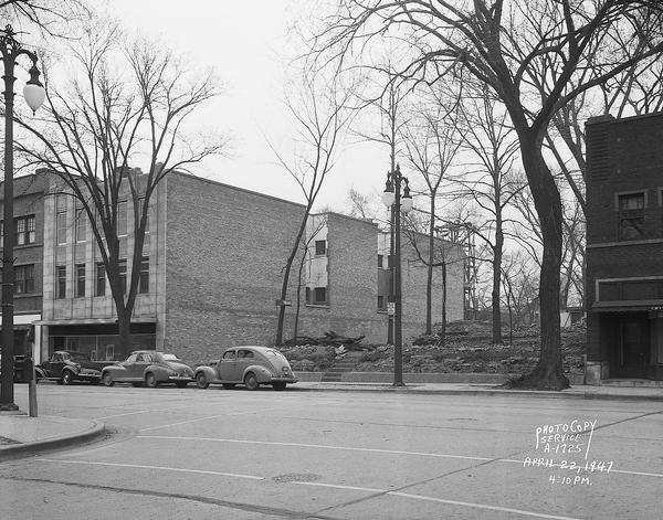 Vacant lot, 636 State Street, between William Busch Beauty Salon and Frederica Cutcheon Photographic Studio, 638 State Street, and the Crystal gift shop, 616 State Street, taken from North Frances Street.