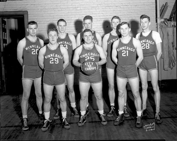 Group portrait of the Winnebago Auto Repair company basketball team in uniform, the City champions of 1947.