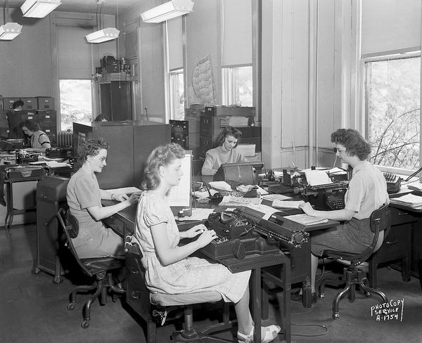 Credit Union National Association <i>Bridge</i> magazine, 1342 East Washington Avenue. There are seven women typing and working in the office.