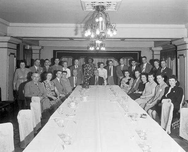 Group portrait of American Federation of Laundry Workers Union members taken in the Colonial Room of the Hotel Loraine, 123 West Washington Avenue.
