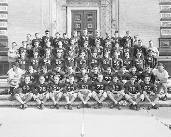 Outdoor group portrait of the Edgewood High School football squad taken in front of the main entrance of the high school, at 1000 Edgewood Avenue.