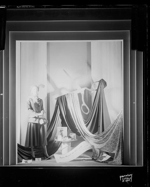 H.S. Manchester Inc., 2 East Mifflin Street, show window displaying the Vogue "1947 look" in women's clothing. Includes a mannequin dressed in the 1947 longer skirt style, and Vogue pattern books.