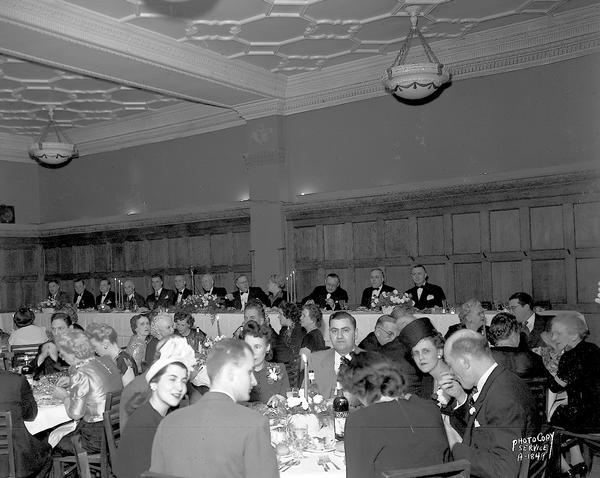 State Hotel Manager's convention banquet, showing diners seated at the speaker's table and in the audience, in the Blue Room at the Park Hotel, 22 South Carroll Street.