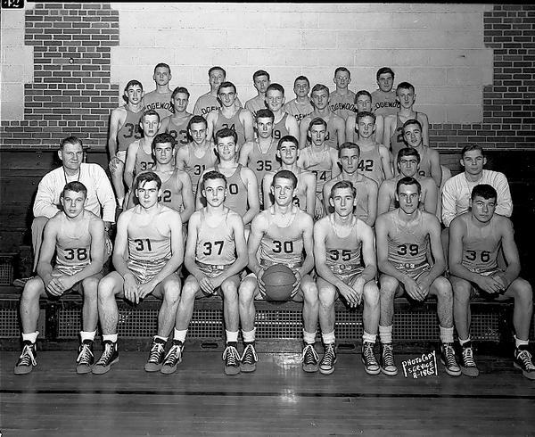 Group portrait of Edgewood High School boys basketball team in uniform, with two coaches.