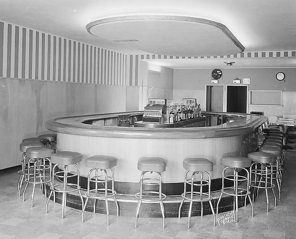Interior of William Miller's Tavern, 118 South Pinckney Street, showing oval bar and bar stools.
