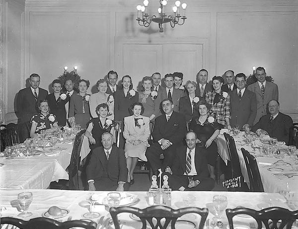 Group portrait of New World Life Insurance Company employees at Christmas Party at Madison Club, 5 East Wilson Street.