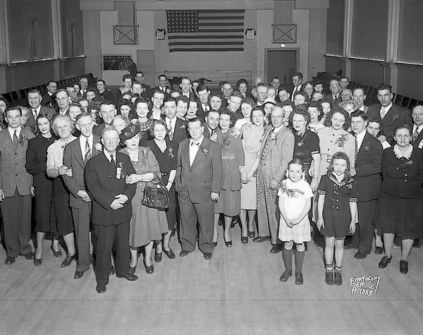 Group portrait of the Milwaukee Road Service Club party, VFW Hall, 113-115 East Mifflin Street, alternate view.