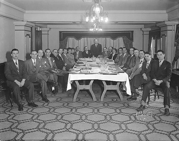 Group portrait of S & M Theatres (Oshkosh Wisconsin) employees seated around table at the Hotel Loraine, 123 West Washington Avenue.