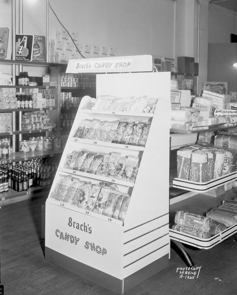 Brach's Candy Shop display at Mel's Grocery Store, 1204 West Dayton Street with other grocery items in background.