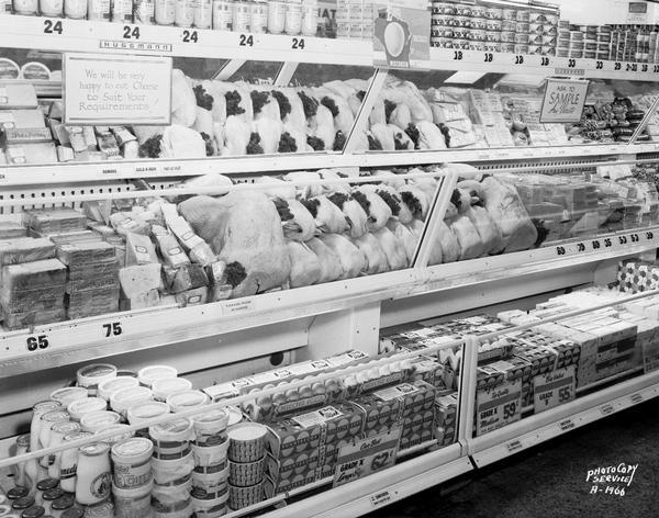 Angle view of poultry and egg display case, with dairy products on either side, at A & P grocery store, 623 University Avenue.