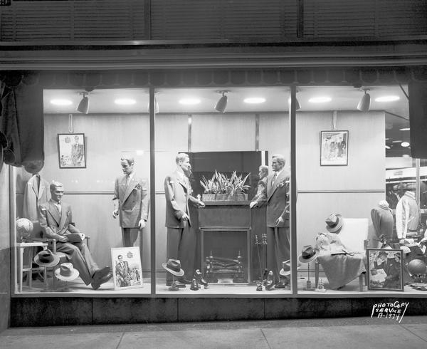 Front view of store window of Hub Clothing Store, 22 West Mifflin Street, featuring men's clothing and accessories.