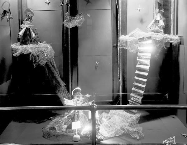 Horizontal view of angels and clouds made from meshed foil, created by East Side High School student. The materials were provided by Research Products materials.