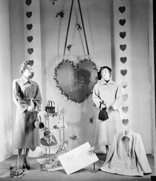 Manchester's, Inc., 2 East Mifflin Street, Valentine window display of women's coats, handbags, and hats.