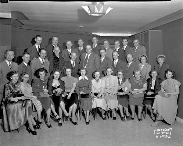 Group portrait of Rexair Corporation employees, 2802 East Johnson Street, attending a sales meeting at the Wings Inn. They made vacuum cleaners. (Wurlitzer ceiling "Star" speaker).