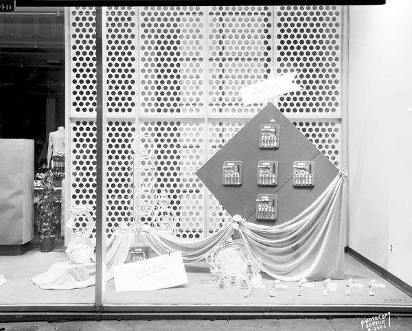 A window display at Manchester's, Inc., 2 East Mifflin Street, featuring Wallace sterling silverware.