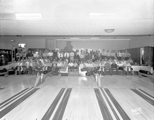 Group portrait of Ohio Chemical & Surgical Company Airco Association bowlers at Bowl-a-Vard bowling alley, 2909 East Washington Avenue.