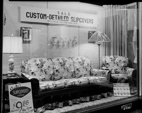 Show window at Hill's Store, 202  State Street, featuring a display of Cretonne slipcovers.