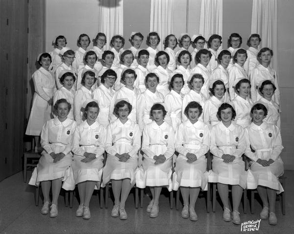 Group portrait of St. Mary's School of Nursing graduates in uniform at St. Mary's Hospital, 720 South Brooks Street.
