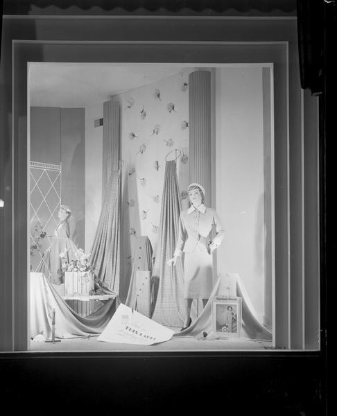 Frostman's woolens window display with two mannequins wearing suits in Manchester's, Inc., corner window #4, taken from East Mifflin Street.