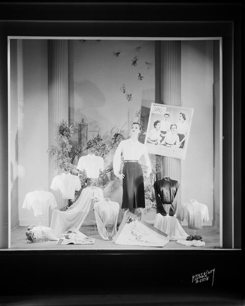 Manchester's, Inc., 2 East Mifflin Street, window display featuring "Nyla-Q" Pilot Blouses, including one female mannequin.