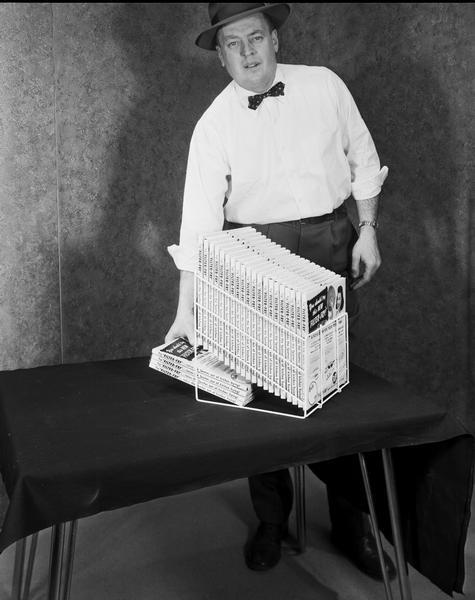 A man displaying a Research Products Corporation rack for Filter Fry frying pan covers, "Takes the spatter out of kitchen frying."
