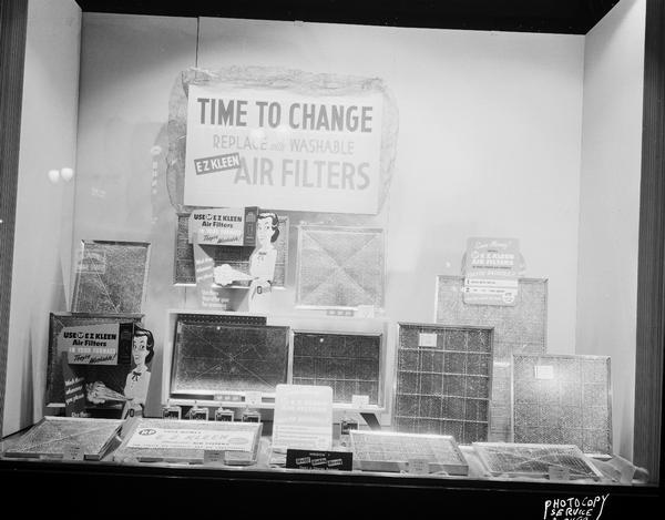 EZ Kleen air filters display window #7 at Wolff Kubly Hirsig.  "Time to Change, replace with washable EZ Kleen air filters."