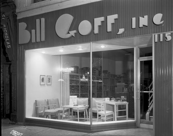 Bill Goff, Inc., office equipment and supplies, rear entrance 115 West Main Street, night view of modern exterior and show window featuring office furniture.