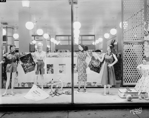 Manchester's, 2 East Mifflin Street, display window "B" featuring women's dresses and shorts, for "cruise attire" with four mannequins.