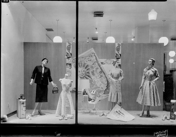 Manchester's, 2 East Mifflin Street, display window "C" featuring women's dresses, shoes and suits "cruise attire" with three mannequins.