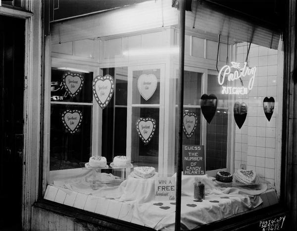 Webers Pastry Kitchen, 118 North Fairchild Street, display window featuring a Valentine cake display, including five sweetheart cakes.