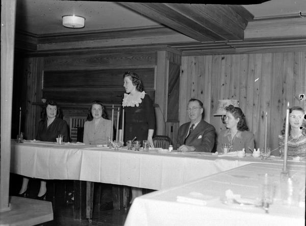 Roundy Coughlin and five women at the head table of the Press Club Dinner at Edgewood College.