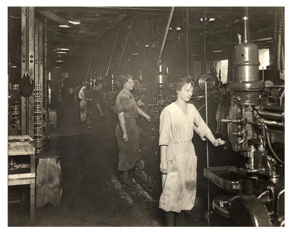 Women working on the automobile assembly line at Nash Motors (later American Motors) during World War I.