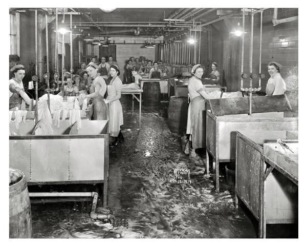 Women working in casing department at the Oscar Mayer & Company meat packing plant, 910 Mayer Avenue.