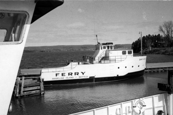 View of the ferry "Gar-How" taken from on board the ferry "Island Queen" while both were docked at Madeline Island. The "Gar-How" was named after Howard Russells' two sons, Gary and Howard.