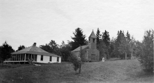 Congregational Church and the Church Cottage located on the Mission grounds at La Pointe.