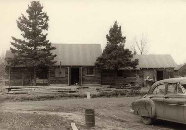 Constructing the Madeline Island Historical Museum in La Pointe which consists of four separate buildings. L-to-r: jail; American Fur Trade storage building; barn; old sailors' home. The museum opened in 1958.