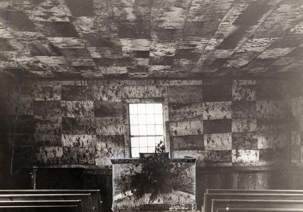 Interior of the Congregational Church on Madeline Island. The ceiling and walls are paneled in birchbark.