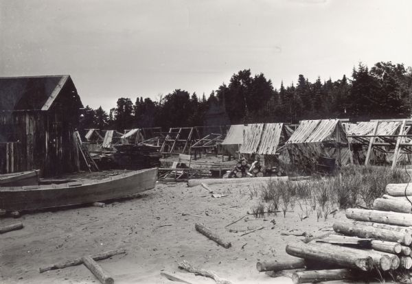 Building, boats, and fish net drying reels on South Twin Island in the Apostle Islands archipelago.
