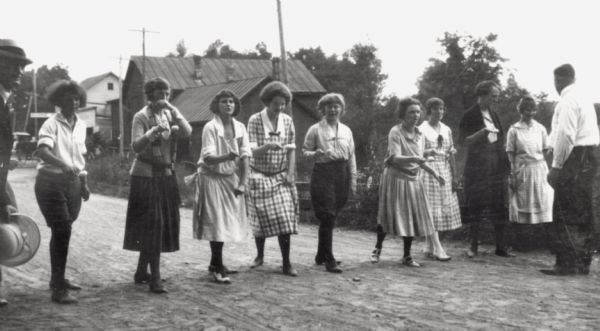 Women participating in egg race game during 4th of July celebration on Madeline Island, Apostle Island. Included are ?,?, Harriet Webb, Peg Caswell and Dorothy Caswell.