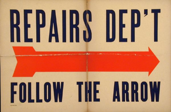 Sign for the Repairs Department. If you want to find the Repairs Department, just "Follow the Arrow."